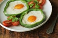 Fried egg in the ring of the bell peppers with herbs Royalty Free Stock Photo