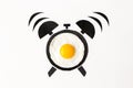 Fried egg in shape of alarm clock, breakfast time concept Royalty Free Stock Photo