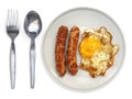 Fried egg side up a plate with spoon and fork on a white background Royalty Free Stock Photo