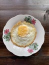Fried egg in a small plate.
