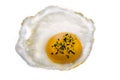 Fried egg with spicings on white background.