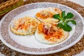fried egg sprinkled with grated horseradish and red pepper, leaf on white plate Royalty Free Stock Photo