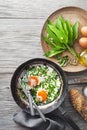 Fried egg with wild garlic leaves