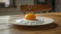 Fried egg with yellow yolk on table background. Breakfast food concept. Royalty Free Stock Photo