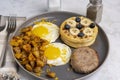 fried eggs along with waffles Royalty Free Stock Photo