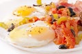 Fried eggs with bacon, tomatoes, olives and slices of cheese Royalty Free Stock Photo