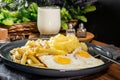 Fried eggs with boiled potatoes and yellow string beans Royalty Free Stock Photo