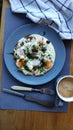 Fried eggs with capers and herbs and coffee, ketogenic breakfast concept, selective focus Royalty Free Stock Photo