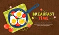 Fried eggs in a frying pan with vegetables, tomatoes, peppers. Healthy brunch with fresh homemade meal on a wooden table. Royalty Free Stock Photo