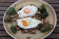 fried eggs with mushrooms as healthy food Royalty Free Stock Photo