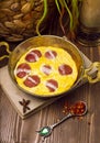 Fried eggs omlette with sucuk in a pan. Royalty Free Stock Photo