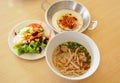 Fried eggs in pan with salad and Vietnamese noodle Royalty Free Stock Photo