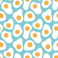 Fried Eggs seamless pattern on blue background. Royalty Free Stock Photo