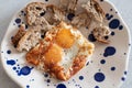 Fried eggs with sesame, served with sour dough toast Royalty Free Stock Photo
