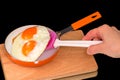 Fried eggs and silicone spatula