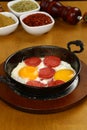 Fried eggs with sucuk on a pan Royalty Free Stock Photo