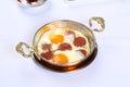 Fried eggs with sucuk on a pan Royalty Free Stock Photo