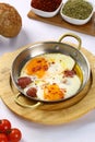 Fried eggs with sucuk on a pan Royalty Free Stock Photo