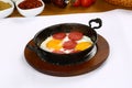 Fried eggs with sucuk on a pan Royalty Free Stock Photo