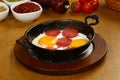 Fried eggs with sucuk on a pan Royalty Free Stock Photo
