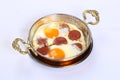 Fried eggs with sucuk on a pan Royalty Free Stock Photo