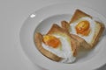 Fried eggs, traditional rustic breakfast, fried eggs, sausage for breakfast on a wooden table background