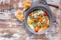 Fried eggs with vegetable nuggets in a gray ceramic frying pan. Tasty breakfast. Copy space Royalty Free Stock Photo