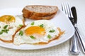 Fried eggs on the white plate