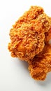 Fried excellence Crispy chicken photographed against a simple white background