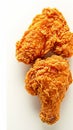 Fried excellence Crispy chicken photographed against a simple white background