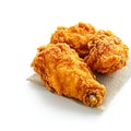 Fried excellence Crispy chicken photographed against a simple white background