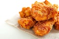 Fried excellence Crispy chicken photographed against a simple white background