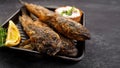 Fried fish Black Sea goby, on a dark background Royalty Free Stock Photo