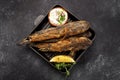 Fried fish Black Sea goby, on a dark background Royalty Free Stock Photo