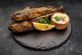 Fried fish Black Sea goby, on a dark background Royalty Free Stock Photo