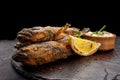 Fried fish Black Sea goby, on a dark background Royalty Free Stock Photo