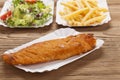 Fried fish and chips on a paper tray Royalty Free Stock Photo