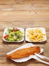 Fried fish and chips on a paper tray Royalty Free Stock Photo