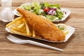 Fried fish and chips on a paper tray Royalty Free Stock Photo