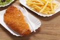 Fried fish and chips on a paper tray Royalty Free Stock Photo