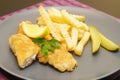 Fried fish and chips on the plate for dinner Royalty Free Stock Photo