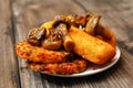 Fried fish filet, veggie burger and grilled champignons Royalty Free Stock Photo