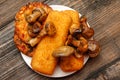 Fried fish filet, veggie burger and grilled champignons Royalty Free Stock Photo