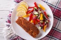 Fried fish fillet with fresh vegetables closeup. horizontal top Royalty Free Stock Photo