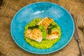 Fried fish fillet with green couscous and fresh asparagus Royalty Free Stock Photo