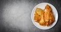 Fried fish fillet sliced for steak or salad cooking food , top view copy space - tilapia fillet fish crispy served on white plate Royalty Free Stock Photo