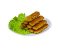 Fried fish fingers on a plate with lettuce isolated on white background Royalty Free Stock Photo