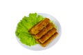 Fried fish fingers on a plate with lettuce isolated on white background Royalty Free Stock Photo