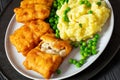 fried fish with mashed potatoes and green peas Royalty Free Stock Photo