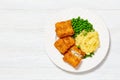 fried fish with mashed potatoes and green peas Royalty Free Stock Photo